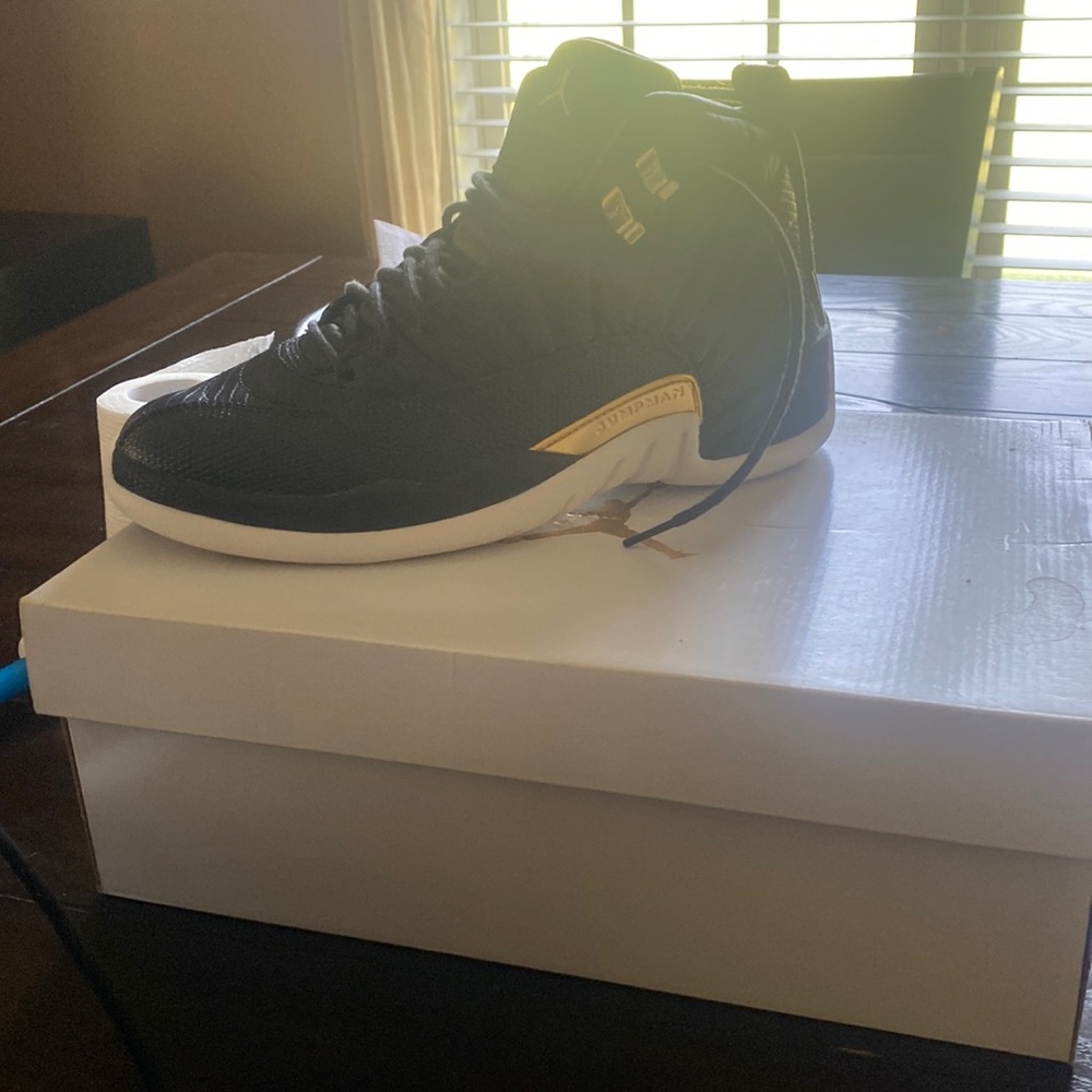 Selling woman’s Jordan 12 black and white and gold.